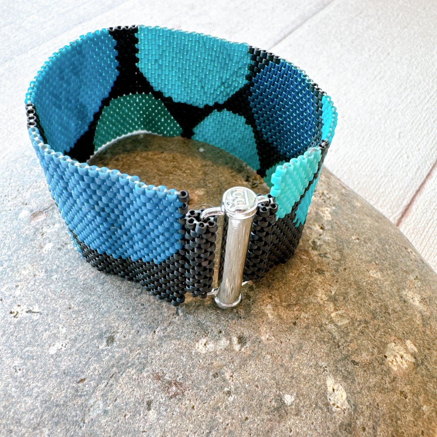 P123 Pulsera Geometría Flotante