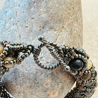 P115 Pulsera Ceniza Serena