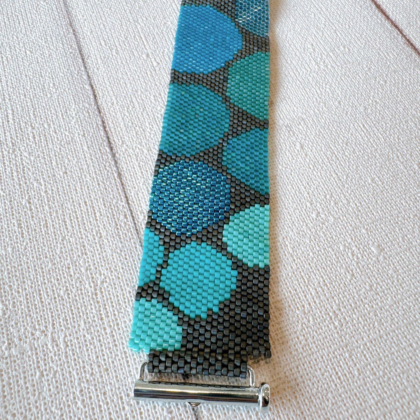 P123 Pulsera Geometría Flotante