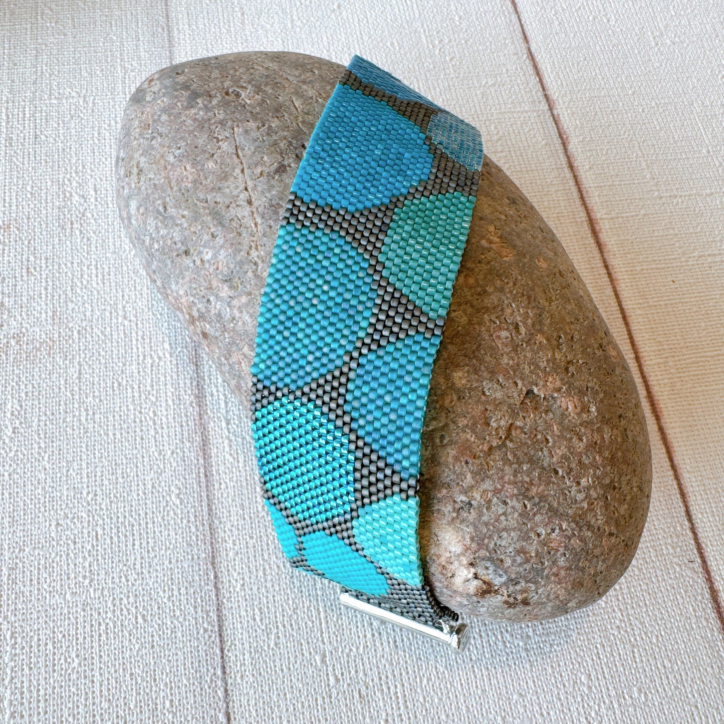 P123 Pulsera Geometría Flotante